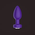Magpie, app-controlled vibrating jewel plug, front view (Purple)
