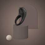 Siskin, app-controlled vibrating ring, on a ceramic plinth (Black)