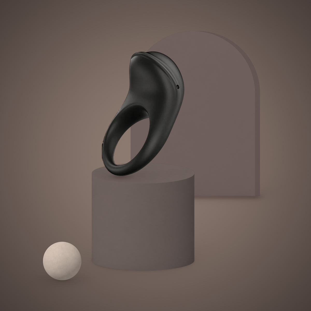 Siskin, app-controlled vibrating ring, on a ceramic plinth (Black)